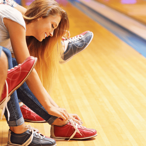 women wearing bowling shoes